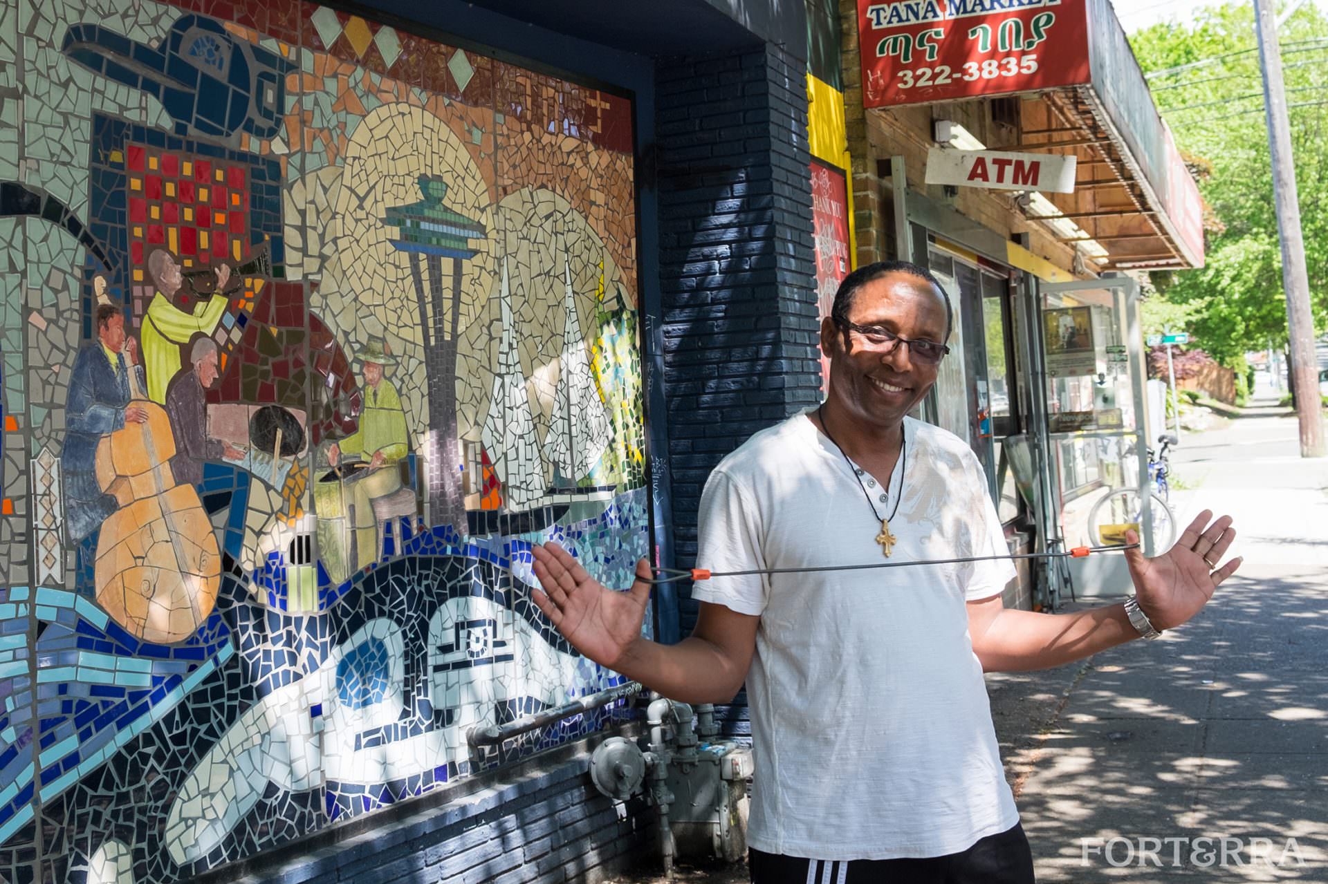 Central District man with outspread arms