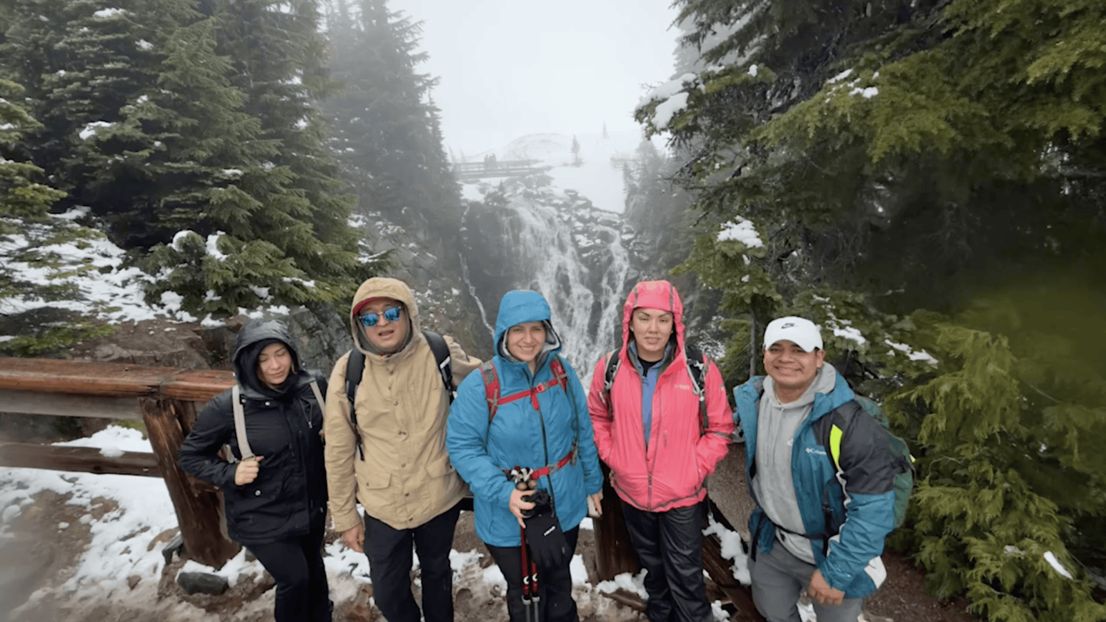 A group of people in the woods on a cold day