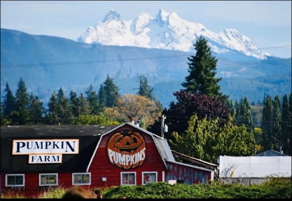 The red barn and landscape of beautiful Foster Farm, nearly 40 acres of farmland under permanent protection.